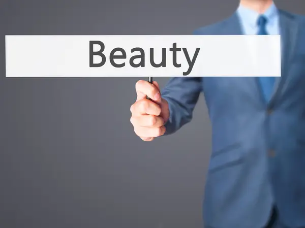 Beauty-affärsman hand innehav skylt — Stockfoto
