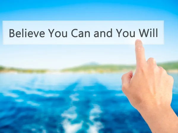 Believe You Can and You Will - Hand pressing a button on blurred — Stockfoto