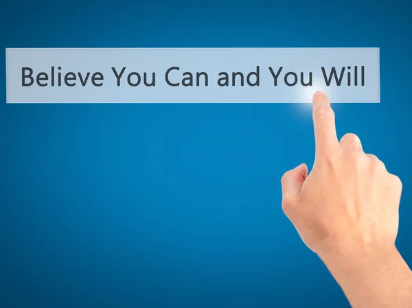 Believe You Can and You Will - Hand pressing a button on blurred — Stockfoto