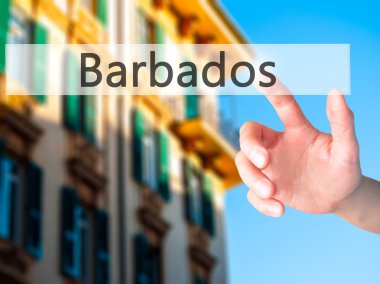 Barbados - arka plan bulanık kavramı üzerinde bir düğmeye basarak el 