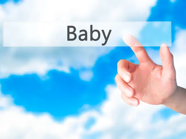 Baby - Hand indrukken van een knop op de onscherpe achtergrond concept op v — Stockfoto