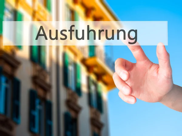 Ausfuhrung (Execution in German) - Hand pressing a button on blu — Stock Photo, Image