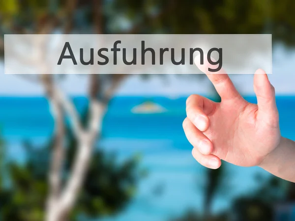 Ausfuhrung (Execution in German) - Hand pressing a button on blu — Stock Photo, Image