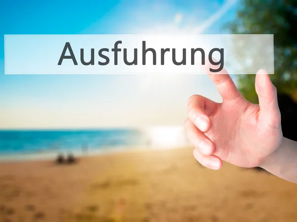 Ausfuhrung (Execution in German) - Hand pressing a button on blu — Stock Photo, Image