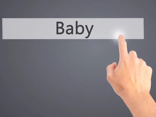 Baby - Hand pressing a button on blurred background concept on v — Stock Photo, Image