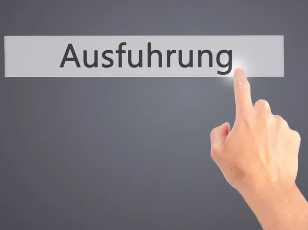 Ausfuhrung (utförande på tyska) - Hand trycka på en knapp på blu — Stockfoto