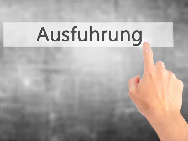 Ausfuhrung (Execution in German) - Hand pressing a button on blu — Stock Photo, Image