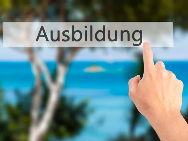 Ausbildung (Education in German) - Hand pressing a button on blu — Stock Photo, Image