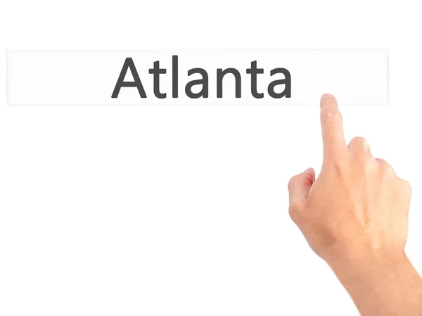 Atlanta - Mano premendo un pulsante sul concetto di sfondo sfocato o — Foto Stock