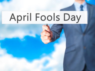 Nisan Fools Day - işaret gösteren iş adamı