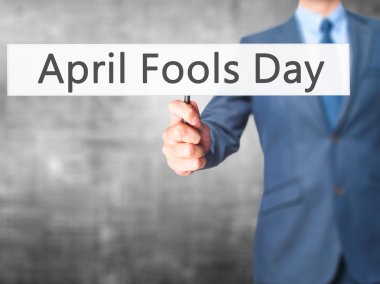 Nisan Fools Day - işaret gösteren iş adamı