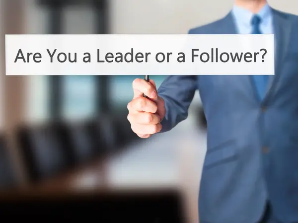 stock image Are You a Leader or a Follower ? - Business man showing sign