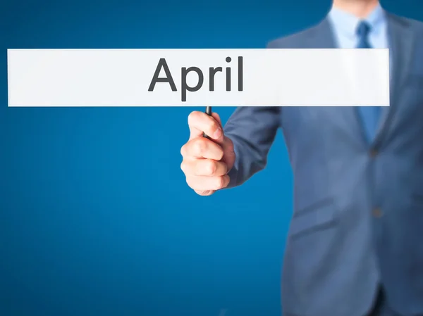April - zakenman teken tonen — Stockfoto
