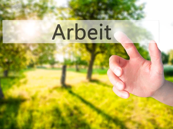 Arbeit (Work in German) - Hand pressing a button on blurred back — Stock Photo, Image