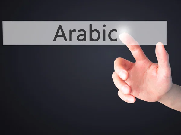 Arabisch - Hand indrukken van een knop op onscherpe achtergrond concept op — Stockfoto