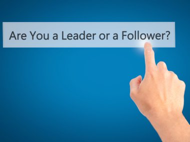 Are You a Leader or a Follower ? - Hand pressing a button on blu clipart