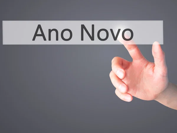 Ano Novo (New Year) - Hand pressing a button on blurred backgrou — Stock Photo, Image