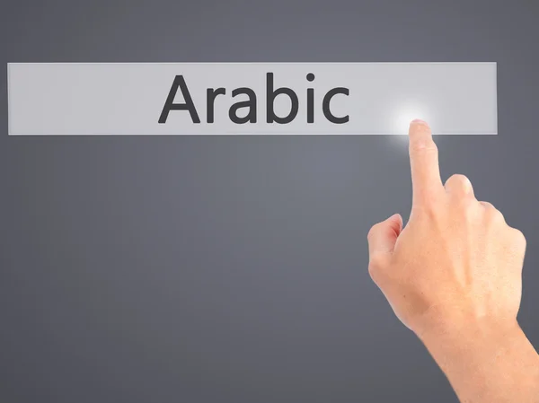 Arabiska - Hand att trycka på en knapp på suddig bakgrund koncept på — Stockfoto