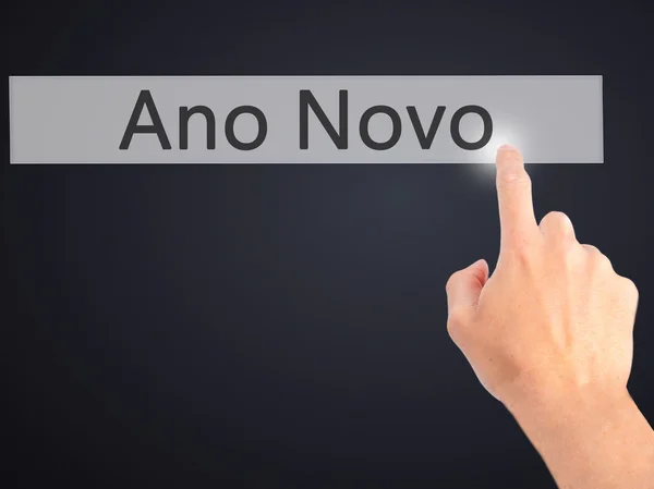 Ano Novo (New Year) - Hand pressing a button on blurred backgrou — Stock Photo, Image