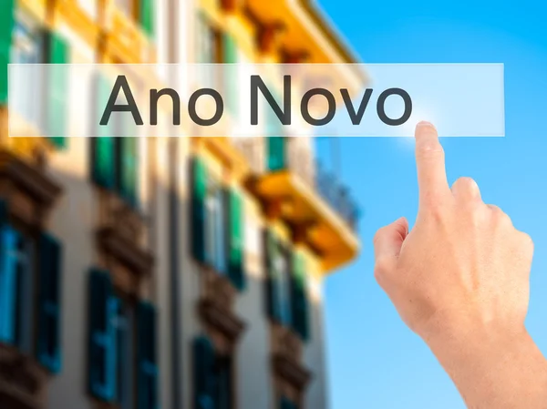 Ano Novo (New Year) - Hand pressing a button on blurred backgrou — Stock Photo, Image