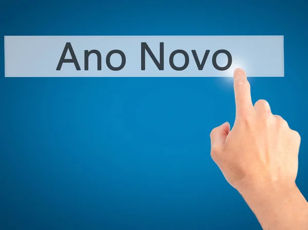 Ano Novo (New Year) - Hand pressing a button on blurred backgrou — Stock Photo, Image