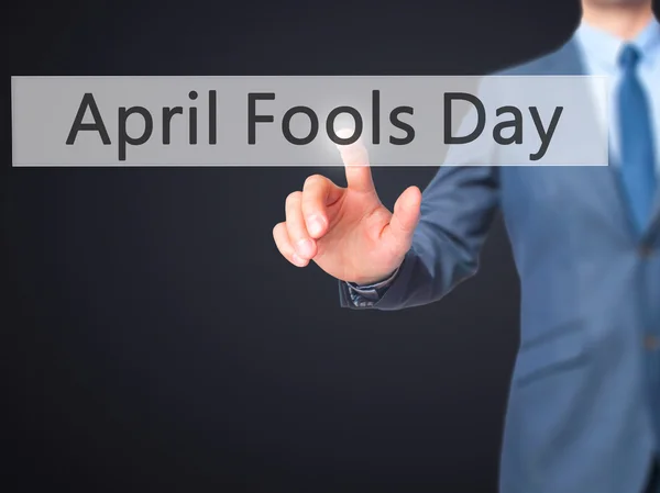 April Fools Day -  Businessman press on digital screen. — Stock Photo, Image