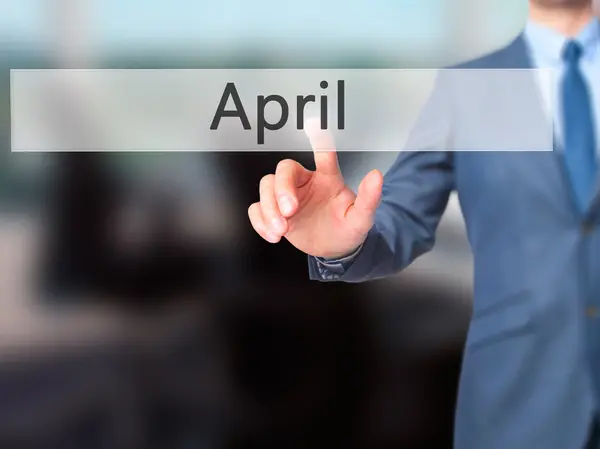 April - zakenman druk op digitaal scherm. — Stockfoto