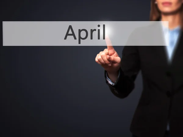 April - Isolated female hand touching or pointing to button — Stock Photo, Image
