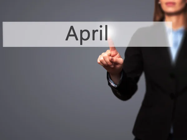 April - Isolated female hand touching or pointing to button — Stock Photo, Image