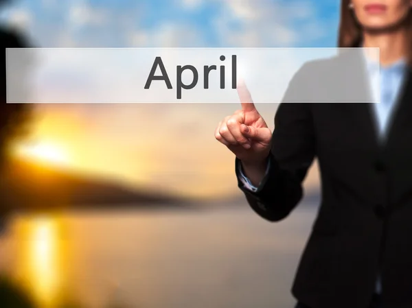 April - Isolated female hand touching or pointing to button — Stock Photo, Image