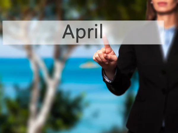 April - Isolated female hand touching or pointing to button — Stock Photo, Image