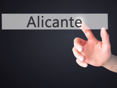 Alicante - arka plan bulanık kavramı üzerinde bir düğmeye basarak el 