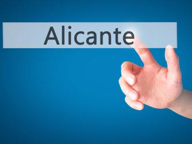 Alicante - arka plan bulanık kavramı üzerinde bir düğmeye basarak el 