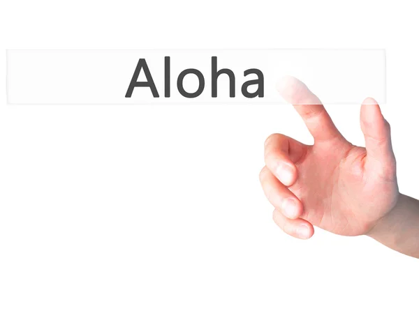 Aloha - Hand indrukken van een knop op onscherpe achtergrond concept op — Stockfoto