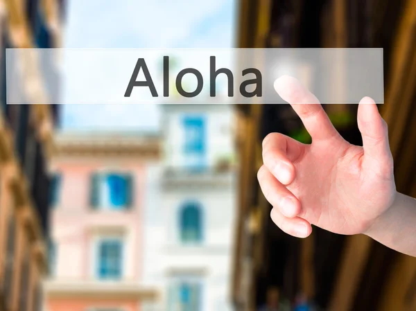 Aloha - Mano premendo un pulsante sul concetto di sfondo sfocato su — Foto Stock