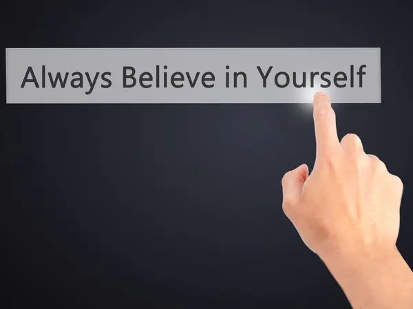 Always Believe in Yourself - Hand pressing a button on blurred b — Stock Photo, Image