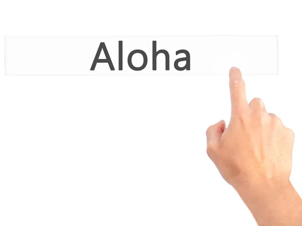 Aloha - Hand indrukken van een knop op onscherpe achtergrond concept op — Stockfoto