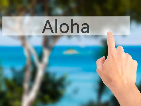 Aloha - χέρι πατώντας ένα κουμπί στην έννοια θολή φόντο — Φωτογραφία Αρχείου