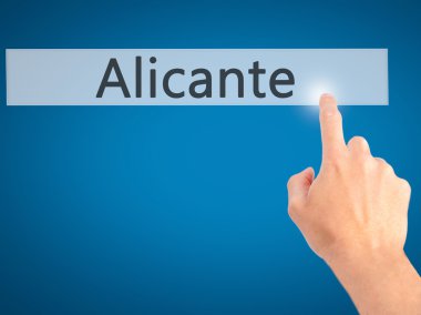 Alicante - arka plan bulanık kavramı üzerinde bir düğmeye basarak el 