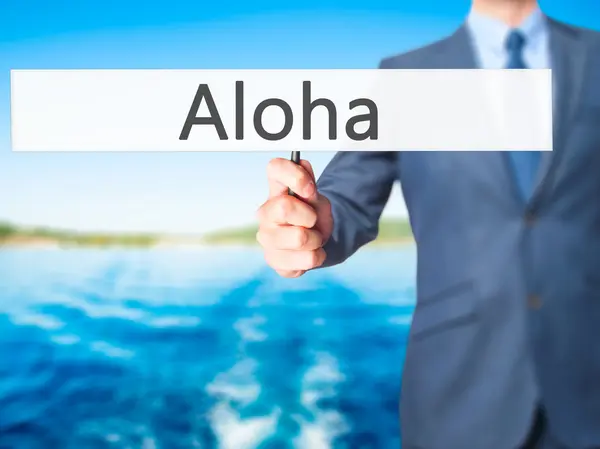 Aloha - Geschäftsmann hält Schild in der Hand — Stockfoto
