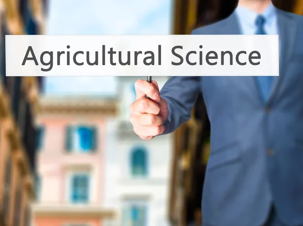 Mezőgazdasági tudomány - üzletember kezében jele — Stock Fotó