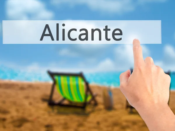 Alicante - Mano pulsando un botón sobre un fondo borroso —  Fotos de Stock