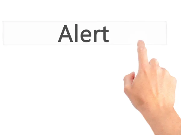 Alert - Hand pressing a button on blurred background concept on — Stock Photo, Image