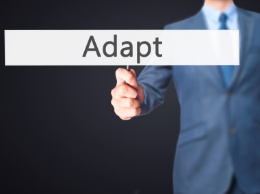 Adapt - İş adamı işareti gösteren