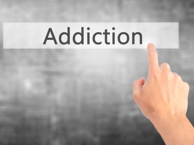 Bağımlılığı - arka plan bulanık kavramı üzerinde bir düğmeye basarak el