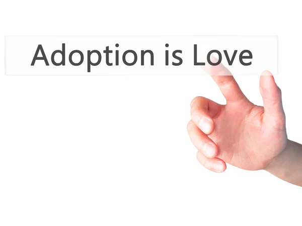 Adoption is Love - Hand pressing a button on blurred background — Stock Photo, Image