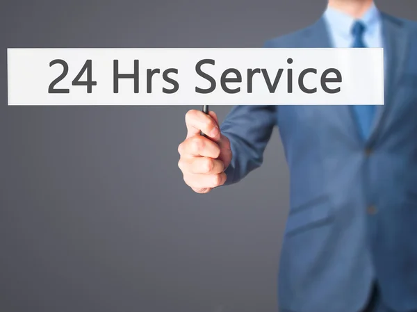 24 Hrs Service - Business man showing sign — Stock Photo, Image