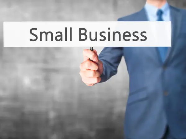 Small Business - Businessman hand holding sign — Stock Photo, Image