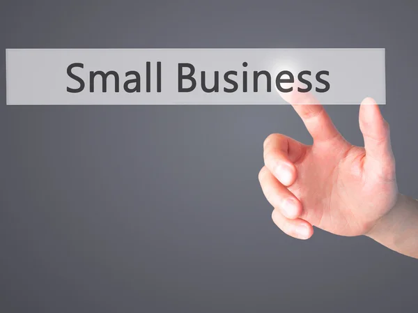 Small Business-ręczne naciśnięcie przycisku na niewyraźne tło co — Zdjęcie stockowe