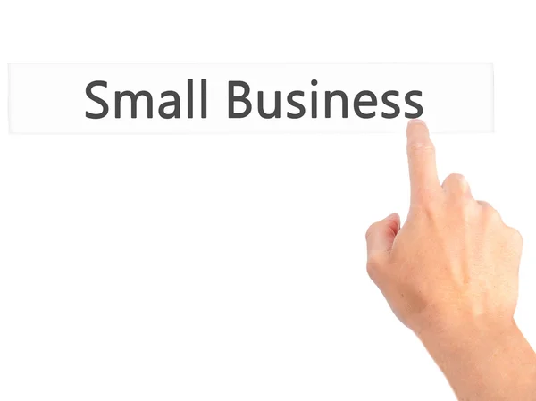 Small Business-met de hand een knop op onscherpe achtergrond samendrukken — Stockfoto